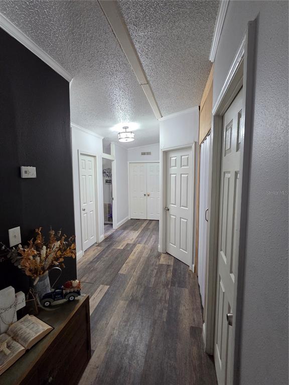 3935 Rambler Avenue St. Cloud, FL 34772 - Photo 27 of 36 a view of a livingroom with wooden floor and a refrigerator