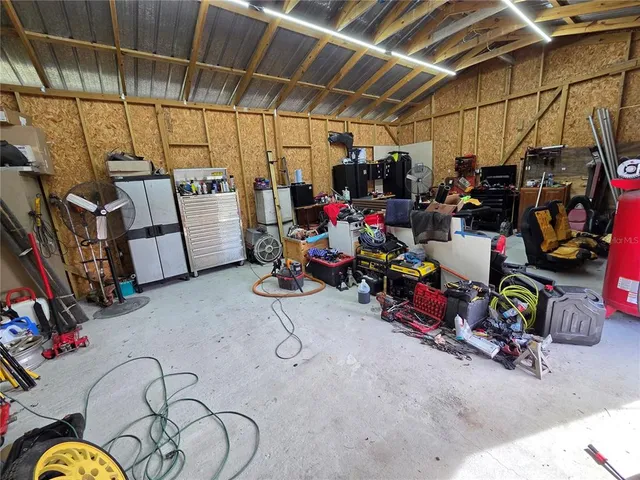 swimming pool view with a seating space