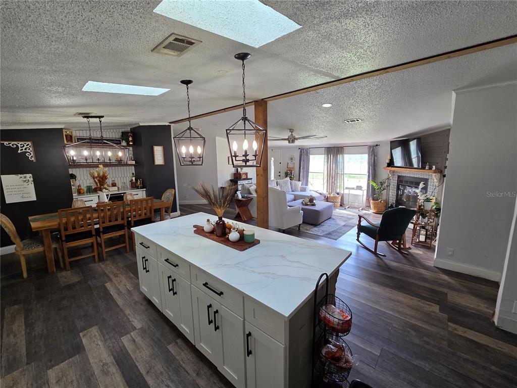 3935 Rambler Avenue St. Cloud, FL 34772 - Photo 9 of 36 a large kitchen with a table and chairs