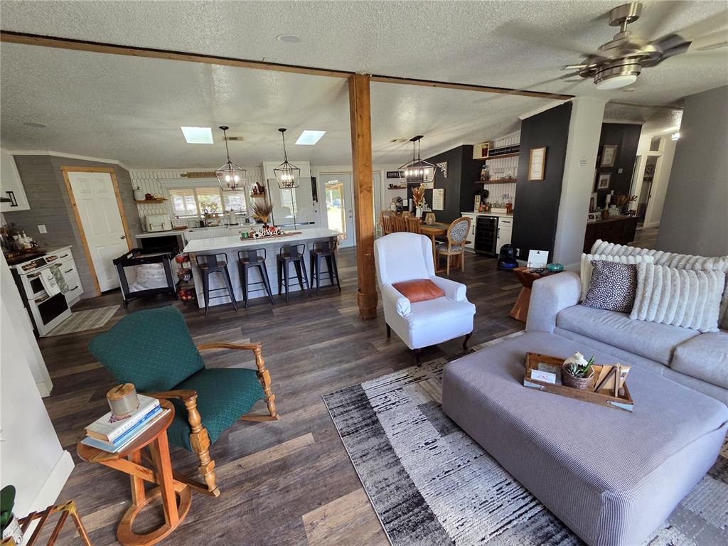 3935 Rambler Avenue St. Cloud, FL 34772 - Photo 10 of 36 a living room with lots of furniture and a view of kitchen