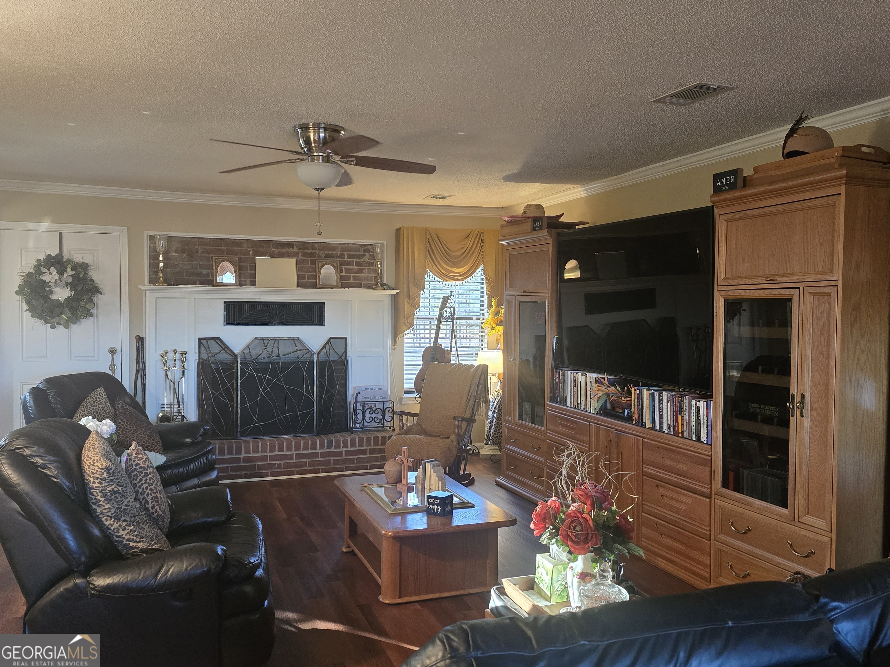 479 Mitchell Loop Bluffton, GA 39824 - Photo 36 of 51 a living room with furniture and a fireplace