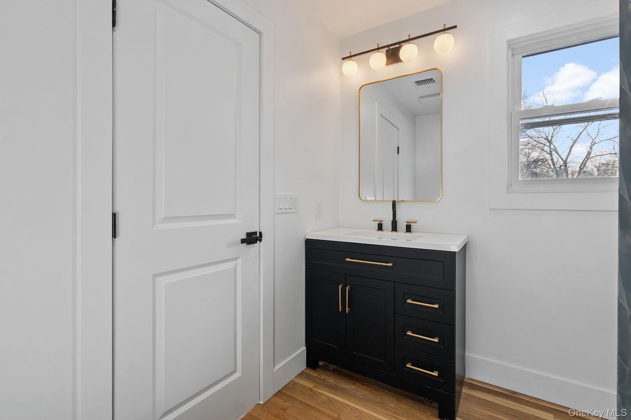 52 Rudolph Road Modena, NY 12548 - Photo 28 of 49 Bathroom featuring vanity and light wood-style floors