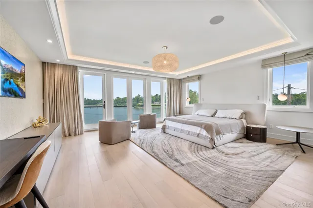 a bedroom with a large bed and a couch