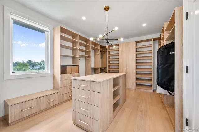 a view of kitchen with stainless steel appliances granite countertop a stove and a refrigerator