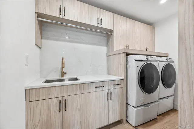 a kitchen with a sink and cabinets