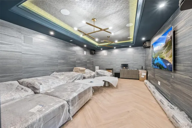 a bed room with bed and a flat screen tv