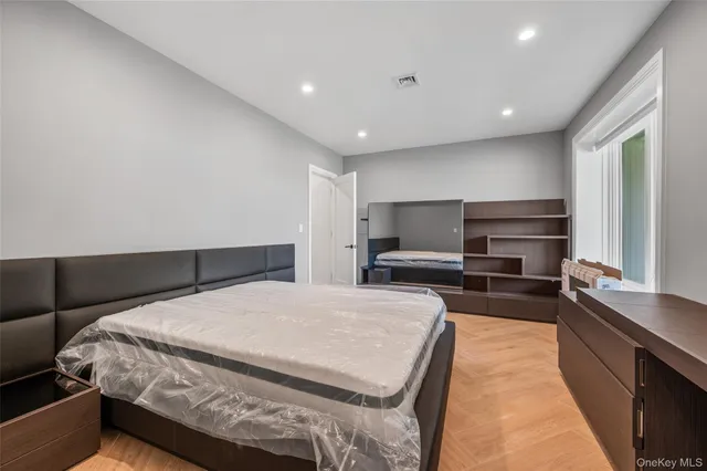 a large kitchen with kitchen island a sink counter space stainless steel appliances and cabinets