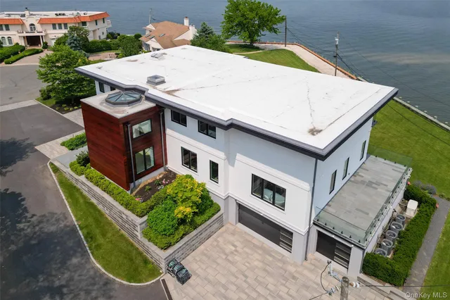 a aerial view of a house with a yard and a large pool