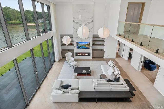 a view of living room with furniture and a fireplace