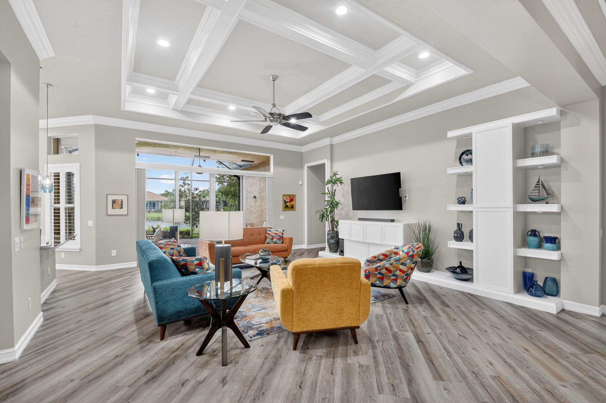 9119 Ribbons Ridge Point Boynton Beach, FL 33473 - Photo 13 of 91 a living room with furniture flat screen tv and wooden floor