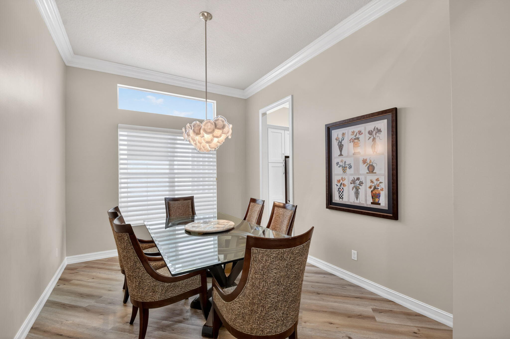 9119 Ribbons Ridge Point Boynton Beach, FL 33473 - Photo 18 of 91 a view of a dining room with furniture window and wooden floor
