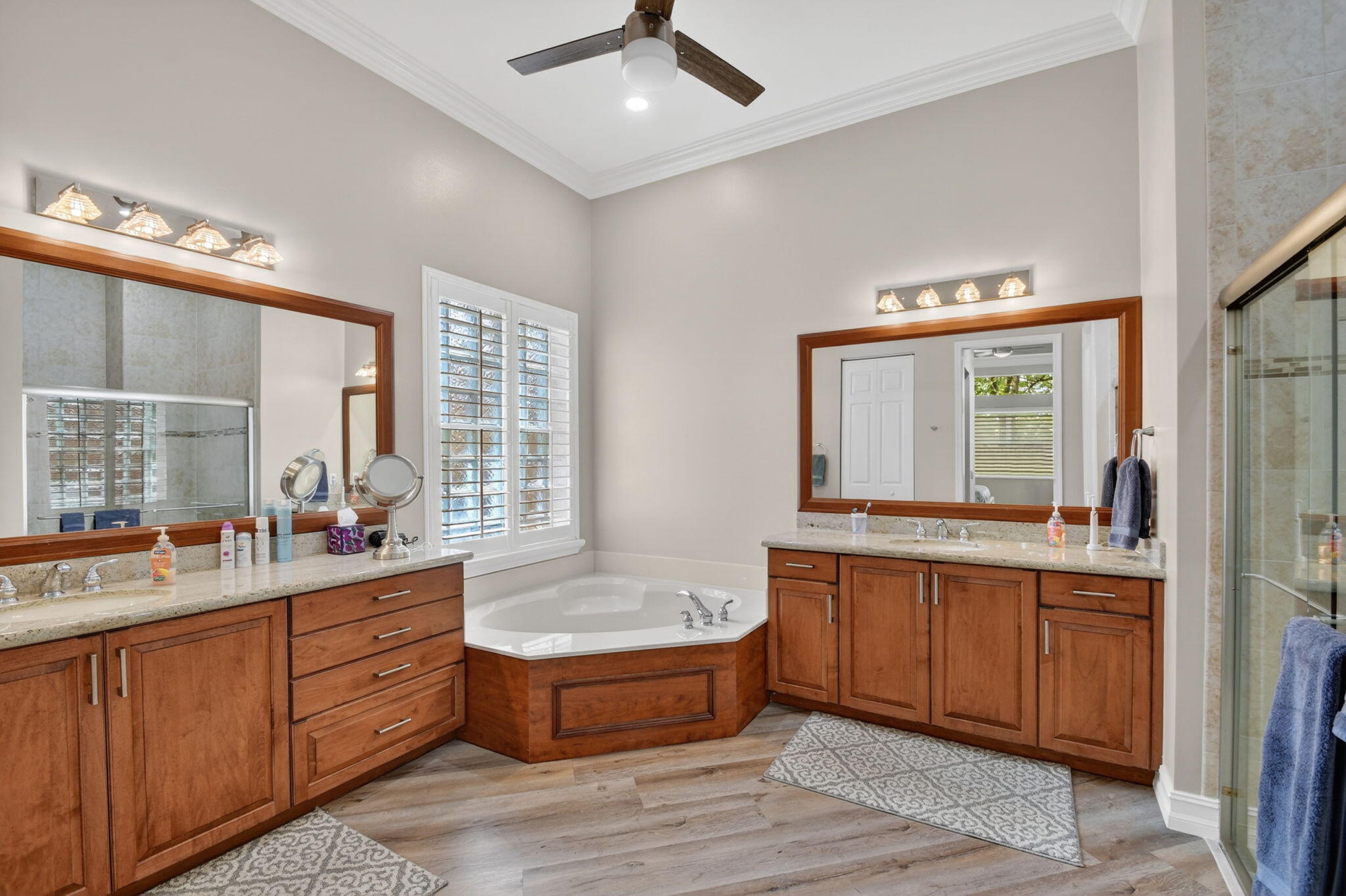 9119 Ribbons Ridge Point Boynton Beach, FL 33473 - Photo 22 of 91 a large spacious bathroom with a double vanity sink a large mirror and a bathtub