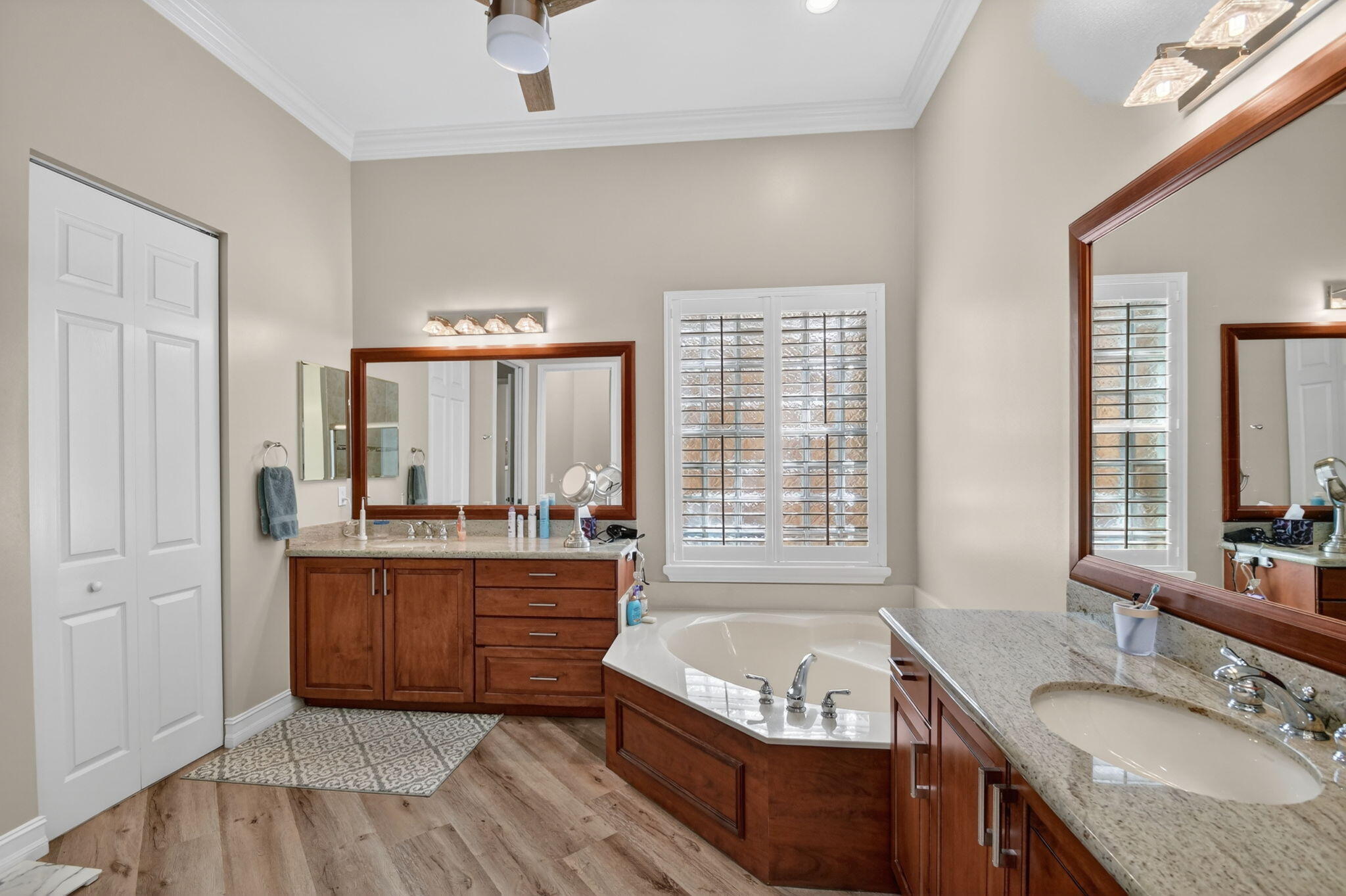 9119 Ribbons Ridge Point Boynton Beach, FL 33473 - Photo 24 of 91 a spacious bathroom with a granite countertop tub sink and mirror