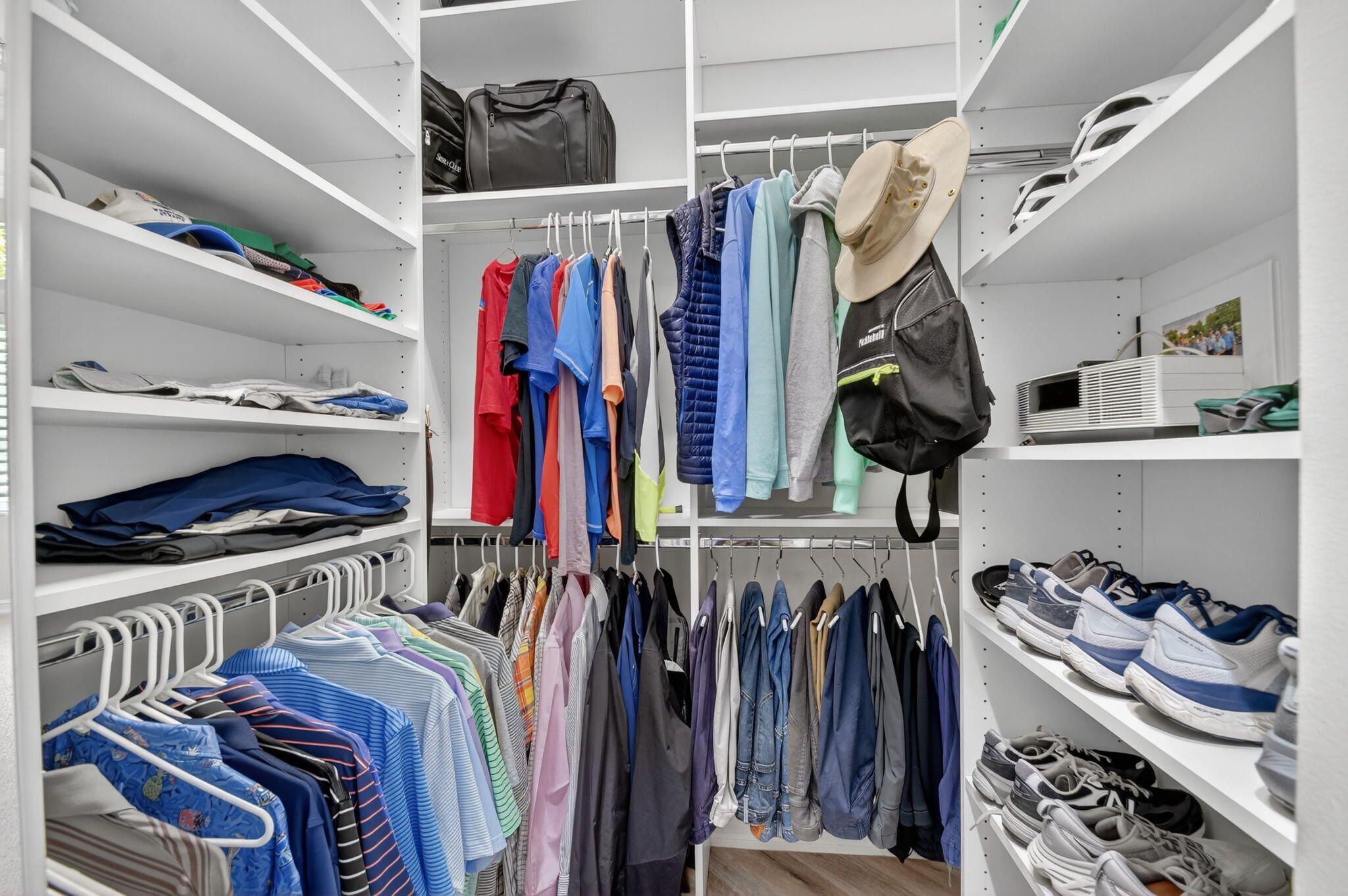 9119 Ribbons Ridge Point Boynton Beach, FL 33473 - Photo 27 of 91 a view of walk in closet with clothes and shoes