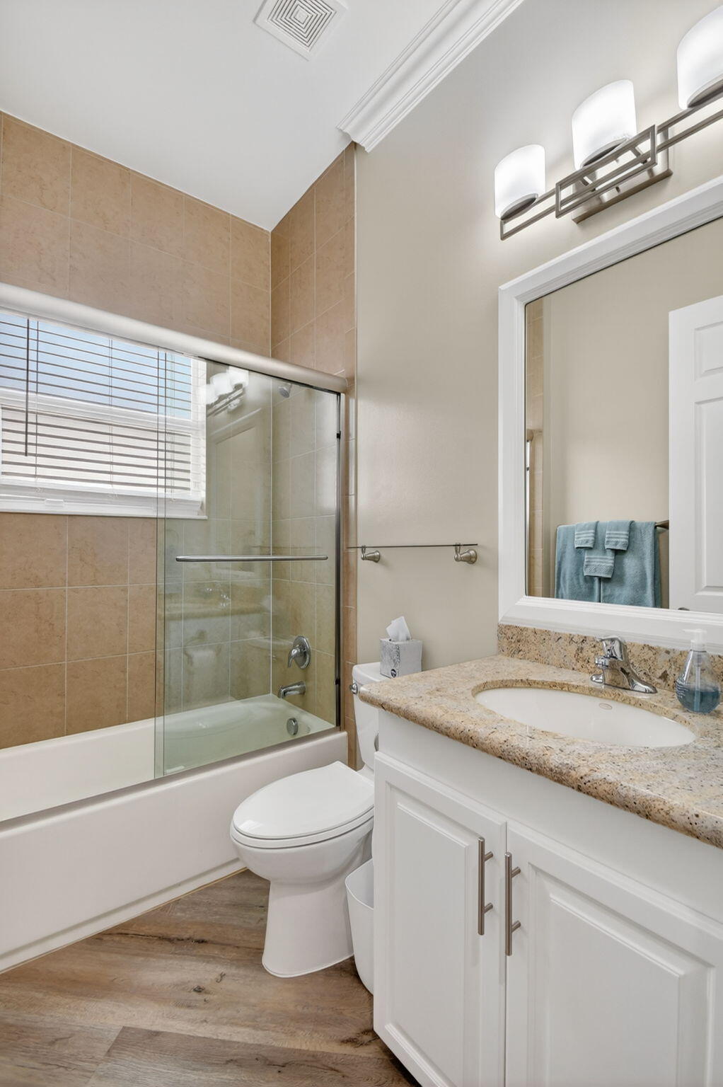 9119 Ribbons Ridge Point Boynton Beach, FL 33473 - Photo 33 of 91 a bathroom with a granite countertop sink toilet a mirror and shower