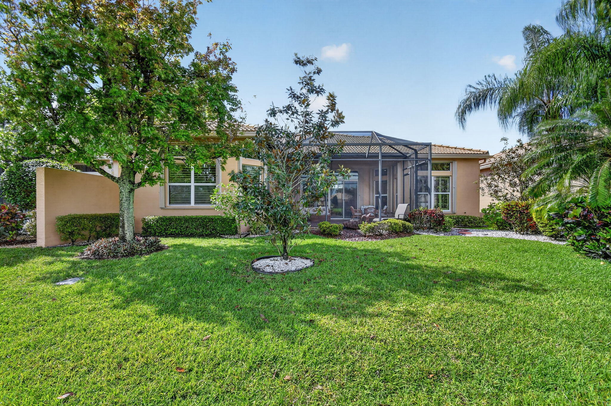 9119 Ribbons Ridge Point Boynton Beach, FL 33473 - Photo 48 of 91 a front view of a house with a yard and potted plants