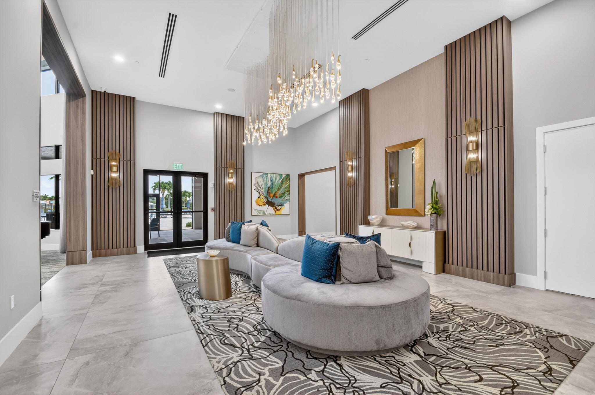 9119 Ribbons Ridge Point Boynton Beach, FL 33473 - Photo 63 of 91 a living room with furniture and a chandelier