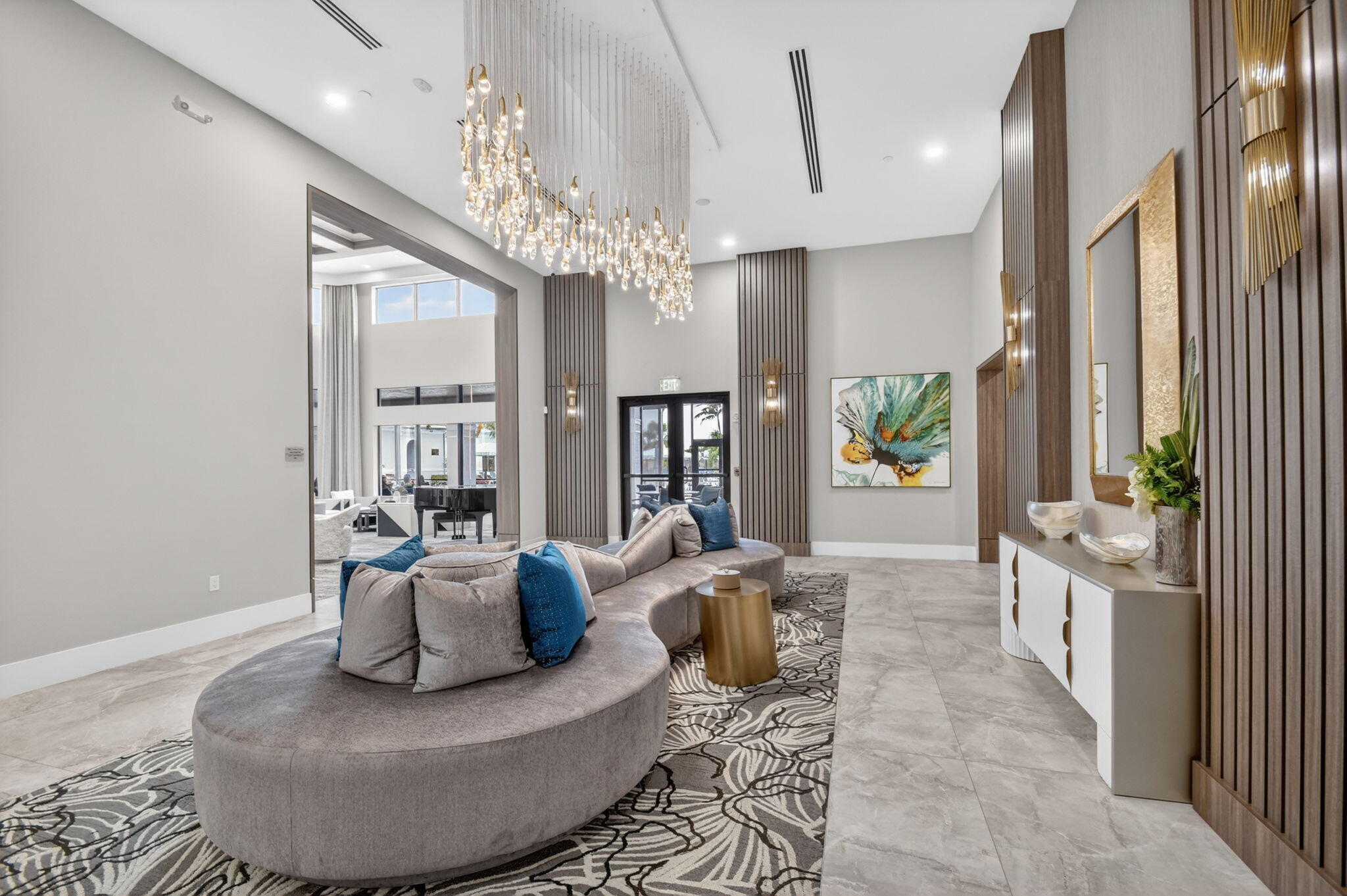 9119 Ribbons Ridge Point Boynton Beach, FL 33473 - Photo 64 of 91 a living room with furniture and a chandelier