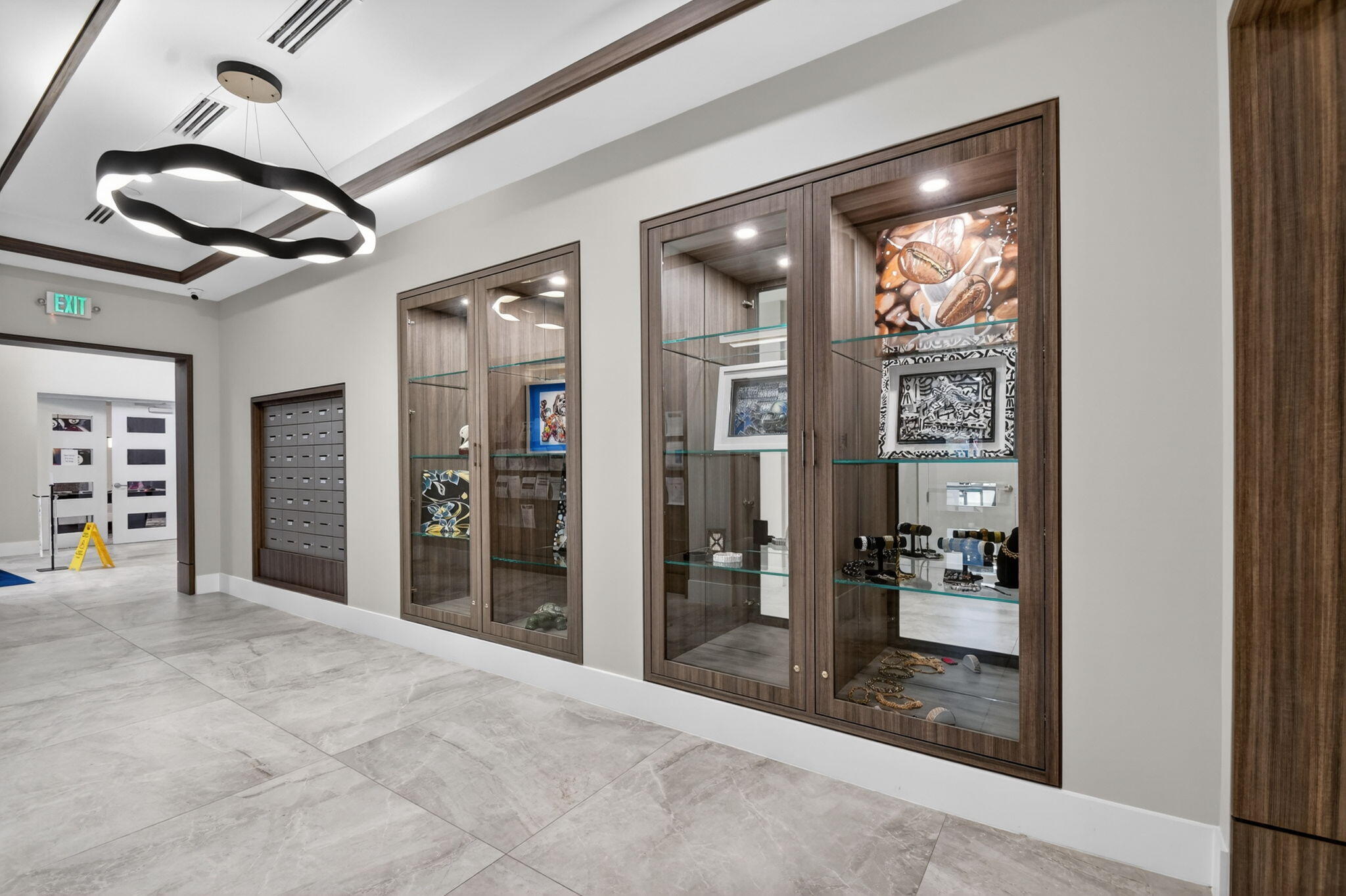 9119 Ribbons Ridge Point Boynton Beach, FL 33473 - Photo 70 of 91 a view of a hallway with a chandelier