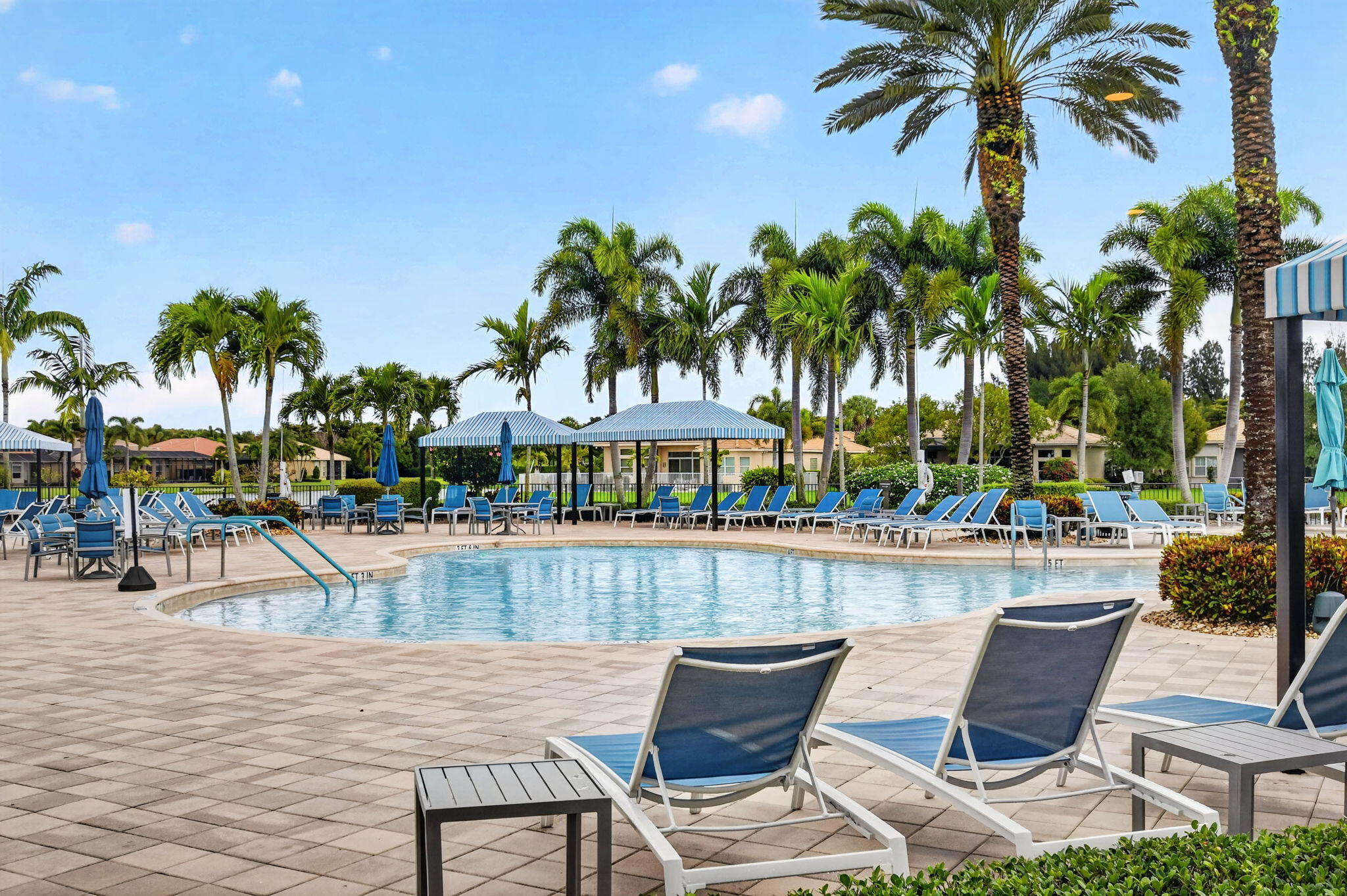9119 Ribbons Ridge Point Boynton Beach, FL 33473 - Photo 76 of 91 a view of a swimming pool with chairs