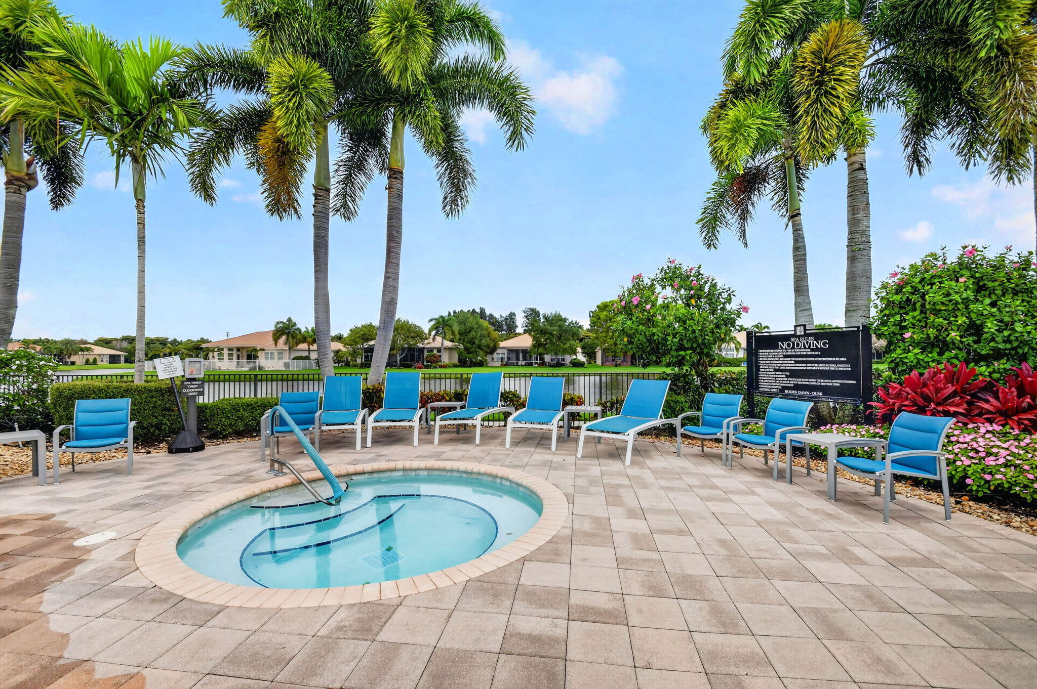 9119 Ribbons Ridge Point Boynton Beach, FL 33473 - Photo 85 of 91 a view of a swimming pool with a sitting table and chairs