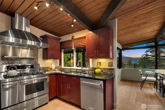 a kitchen with a sink and large cabinets
