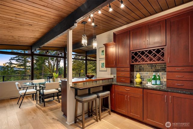 a room with furniture and large windows