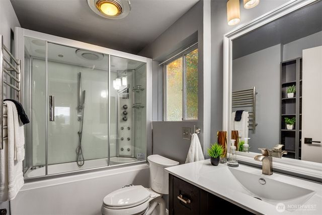 a bedroom with a bed couch and window