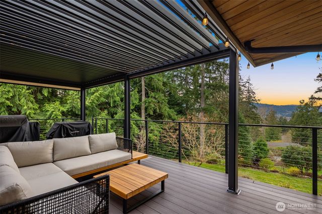 a balcony view with a seating space