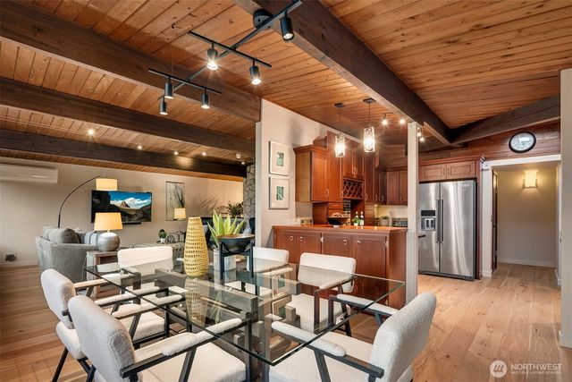 a kitchen with stainless steel appliances granite countertop wooden cabinets stove top oven and sink