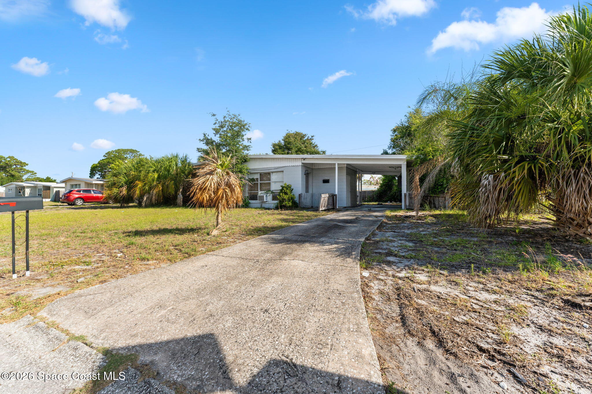 1042 Azalea Lane Cocoa, FL 32922 - Photo 1 of 26 a front view of a house with a yard