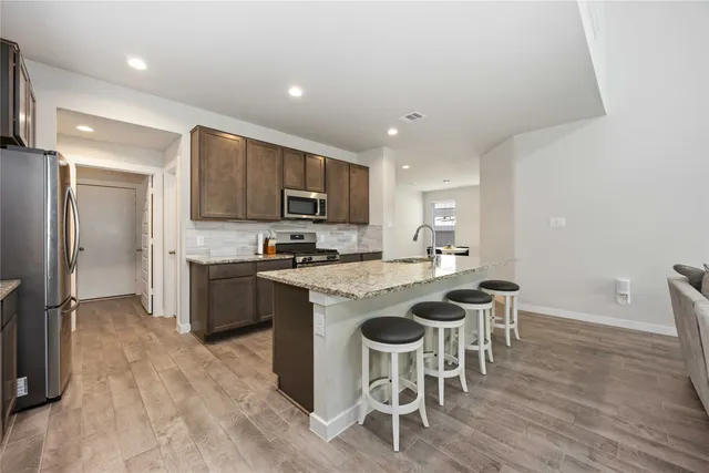 a living room with furniture fireplace and flat screen tv