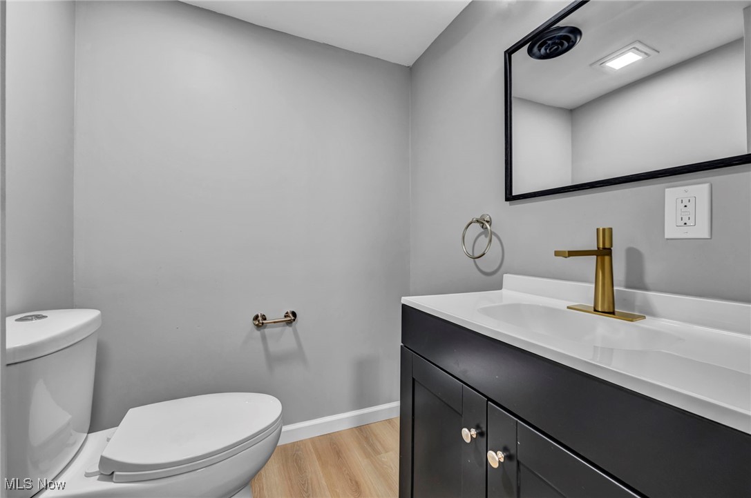 20202 Sumpter Road Cleveland, OH 44128 - Photo 34 of 46 Bathroom with vanity and light wood-style floors