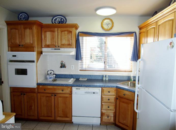 7406 Axton Street Springfield, VA 22151 - Photo 29 of 30 Custom Maple Hardwood Cabinets in the Kitchen