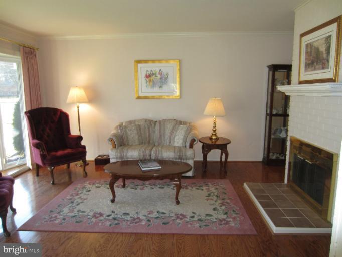 7406 Axton Street Springfield, VA 22151 - Photo 6 of 30 Pretty Painted Brick Fireplace for Cozy Winters