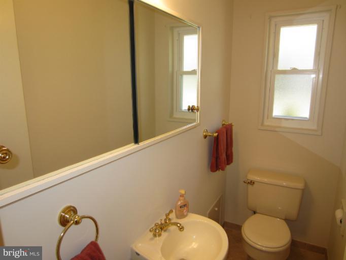 7406 Axton Street Springfield, VA 22151 - Photo 8 of 30 Guest Powder Bath with Ceramic Tile Flooring