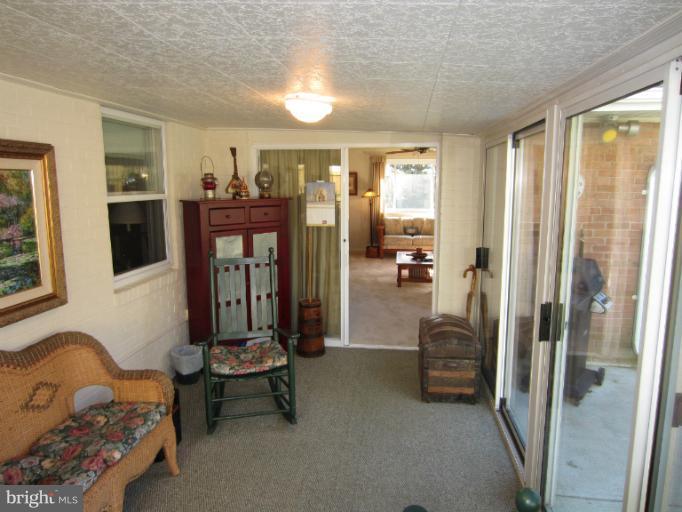 7406 Axton Street Springfield, VA 22151 - Photo 10 of 30 Spacious Finished Sunroom opens to Back Patio