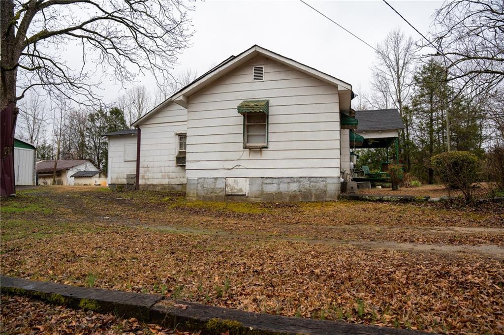 1702 Jones Ferry Road Elberton, GA 30635 - Photo 16 of 21 a view of a house with a yard