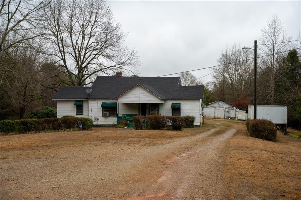 1702 Jones Ferry Road Elberton, GA 30635 - Photo 19 of 21 a front view of a house with a yard and garage