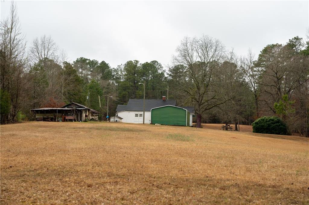 1702 Jones Ferry Road Elberton, GA 30635 - Photo 20 of 21 a backyard of a house with table and chairs