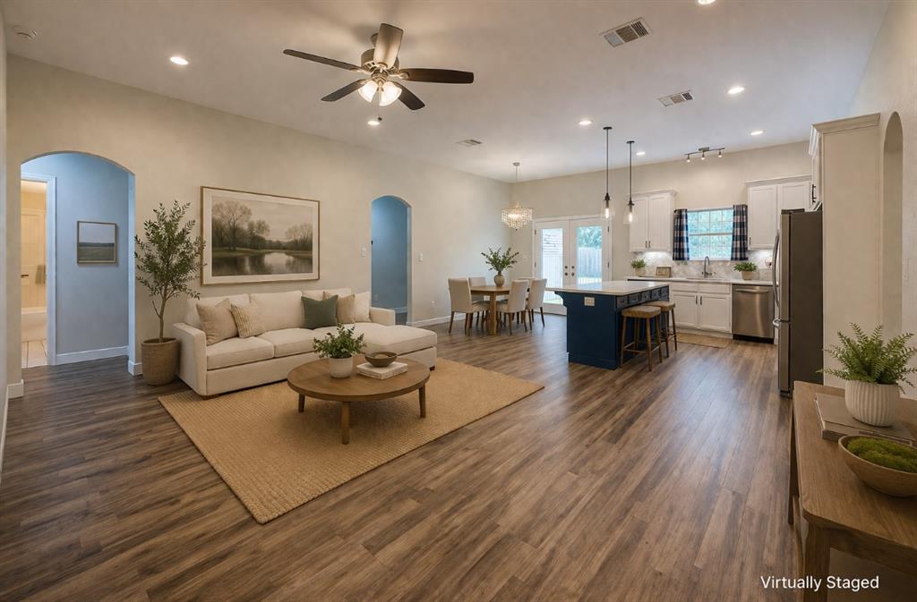 142 Tomahawk Drive Waco, TX 76705 - Photo 2 of 14 a living room with furniture kitchen view and a wooden floor