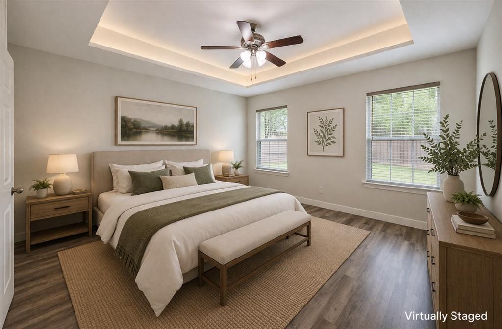 142 Tomahawk Drive Waco, TX 76705 - Photo 5 of 14 a spacious bedroom with a bed and a potted plant