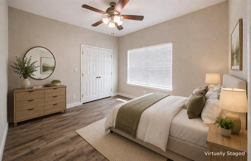 142 Tomahawk Drive Waco, TX 76705 - Photo 10 of 14 a bedroom with a bed and a chandelier