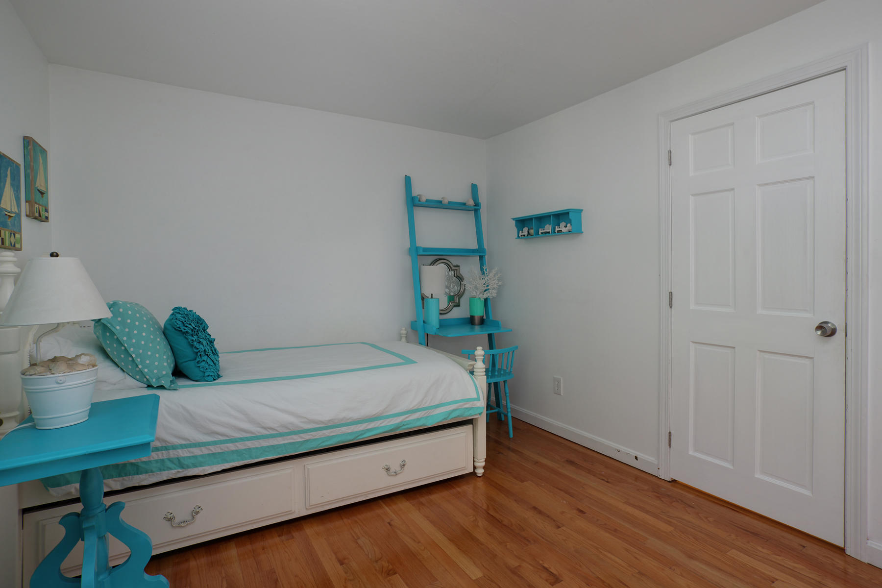 132 Harbor Hills Road Centerville, MA 02632 - Photo 13 of 31 a bed sitting in a bedroom next to a window