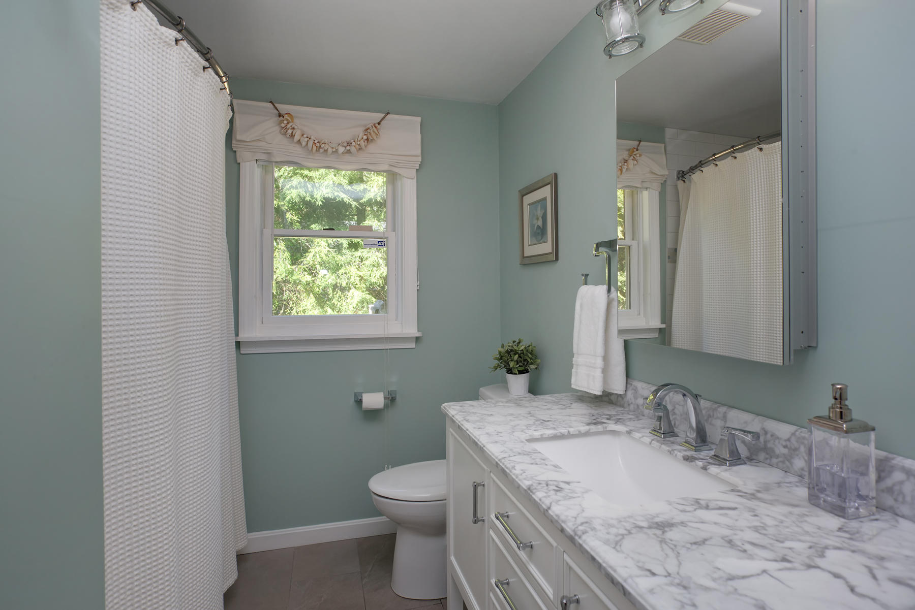 132 Harbor Hills Road Centerville, MA 02632 - Photo 14 of 31 a bathroom with a granite countertop sink a toilet and a mirror