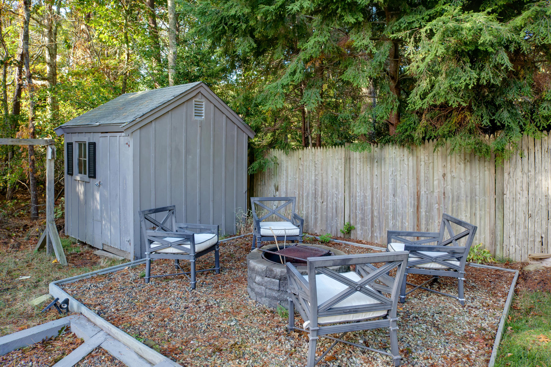 132 Harbor Hills Road Centerville, MA 02632 - Photo 24 of 31 a backyard of a house with outdoor seating