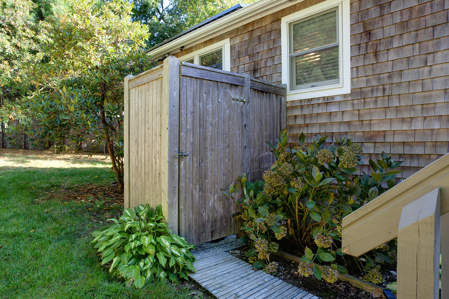 132 Harbor Hills Road Centerville, MA 02632 - Photo 25 of 31 a backyard of a house with lots of green space