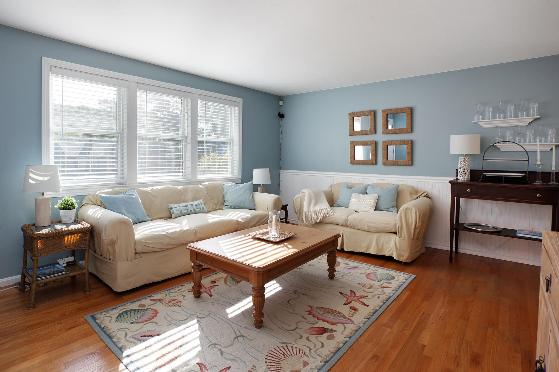 132 Harbor Hills Road Centerville, MA 02632 - Photo 3 of 31 a living room with furniture a rug and a large window