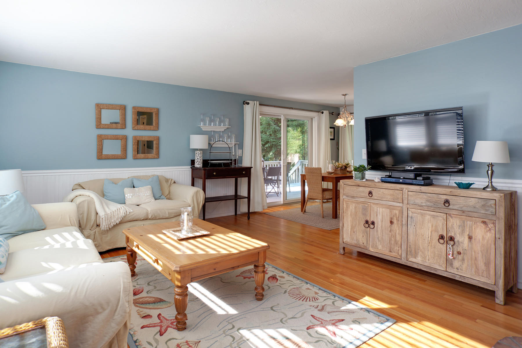 132 Harbor Hills Road Centerville, MA 02632 - Photo 4 of 31 a living room with furniture and a flat screen tv