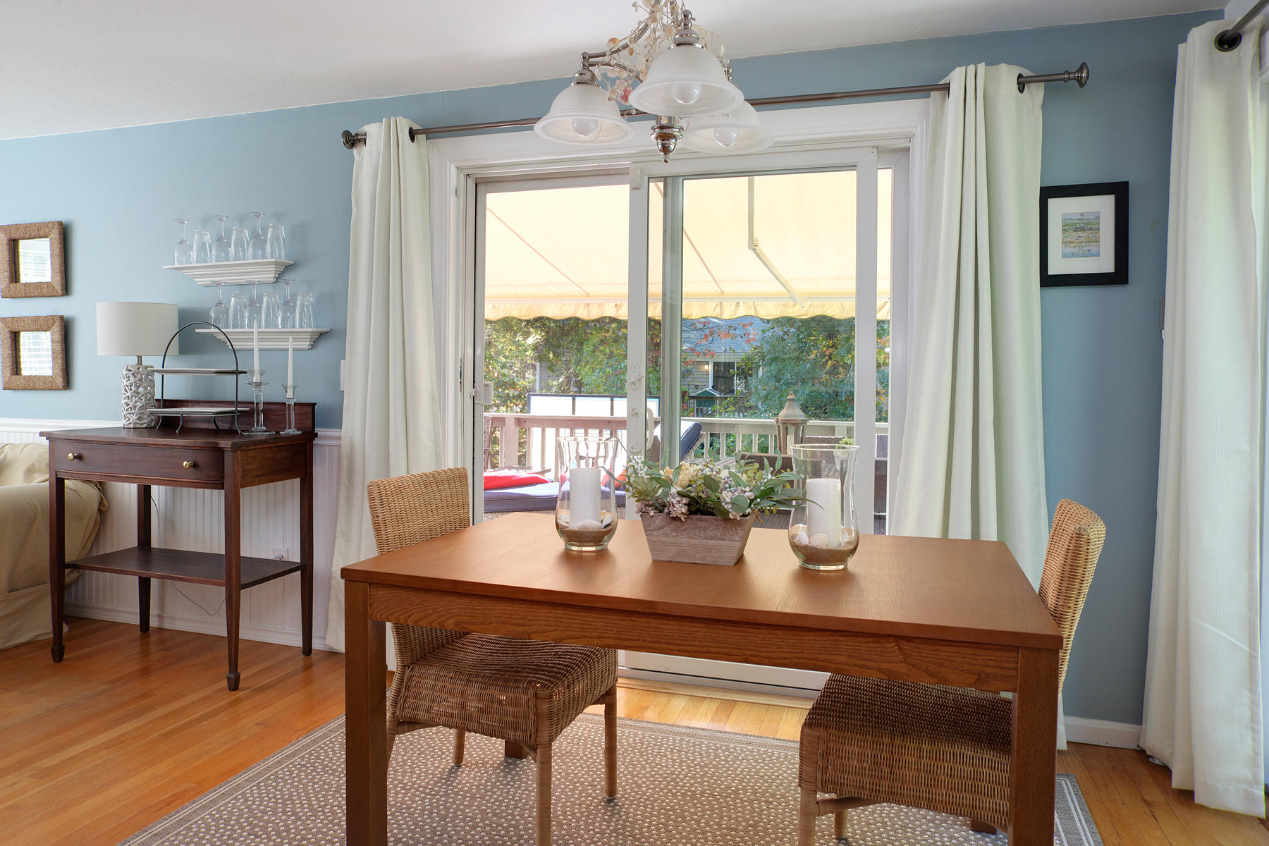 132 Harbor Hills Road Centerville, MA 02632 - Photo 7 of 31 a dining room with furniture a chandelier and wooden floor